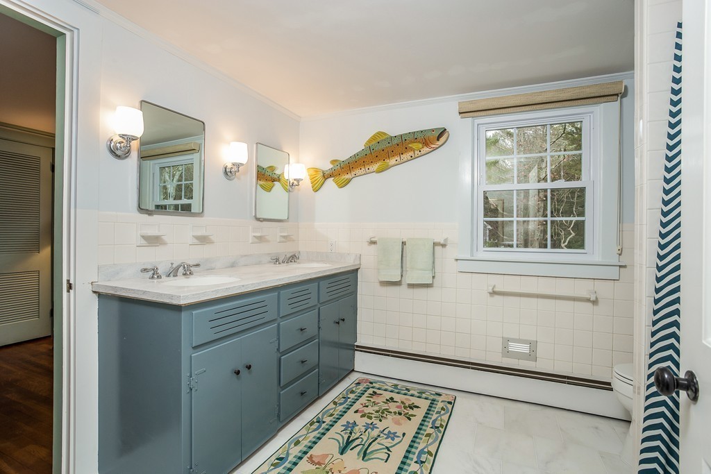 10 Holly Road Marion, MA 02738 - Photo 18 of 29 a bathroom with a sink and a mirror