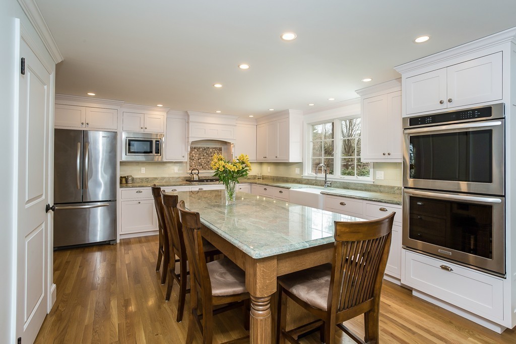 10 Holly Road Marion, MA 02738 - Photo 2 of 29 a kitchen with stainless steel appliances granite countertop a refrigerator a stove a sink a dining table and chairs
