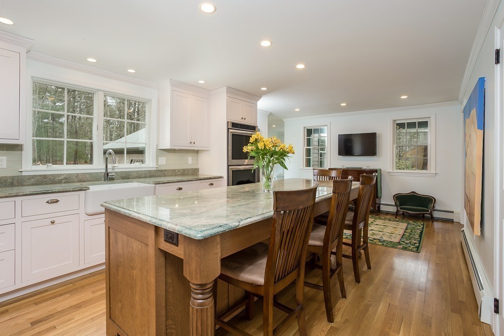 10 Holly Road Marion, MA 02738 - Photo 3 of 29 a kitchen with a table chairs stove and cabinets
