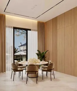 a view of a dining room with furniture and window