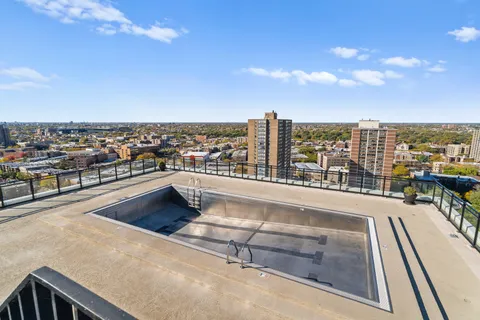a view of swimming pool from a balcony