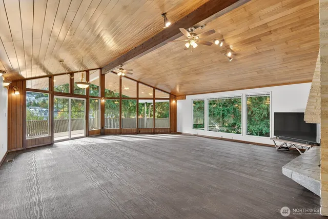 a view of an empty room with a large window