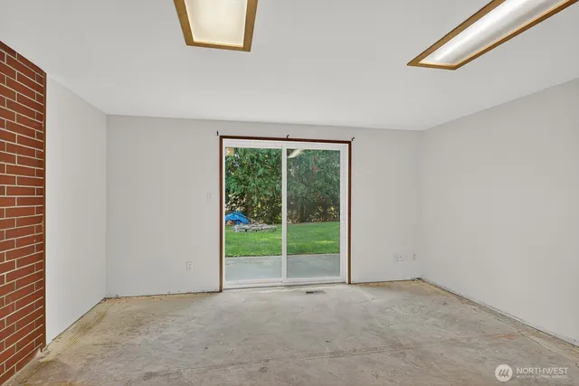 a view of a room with a large window