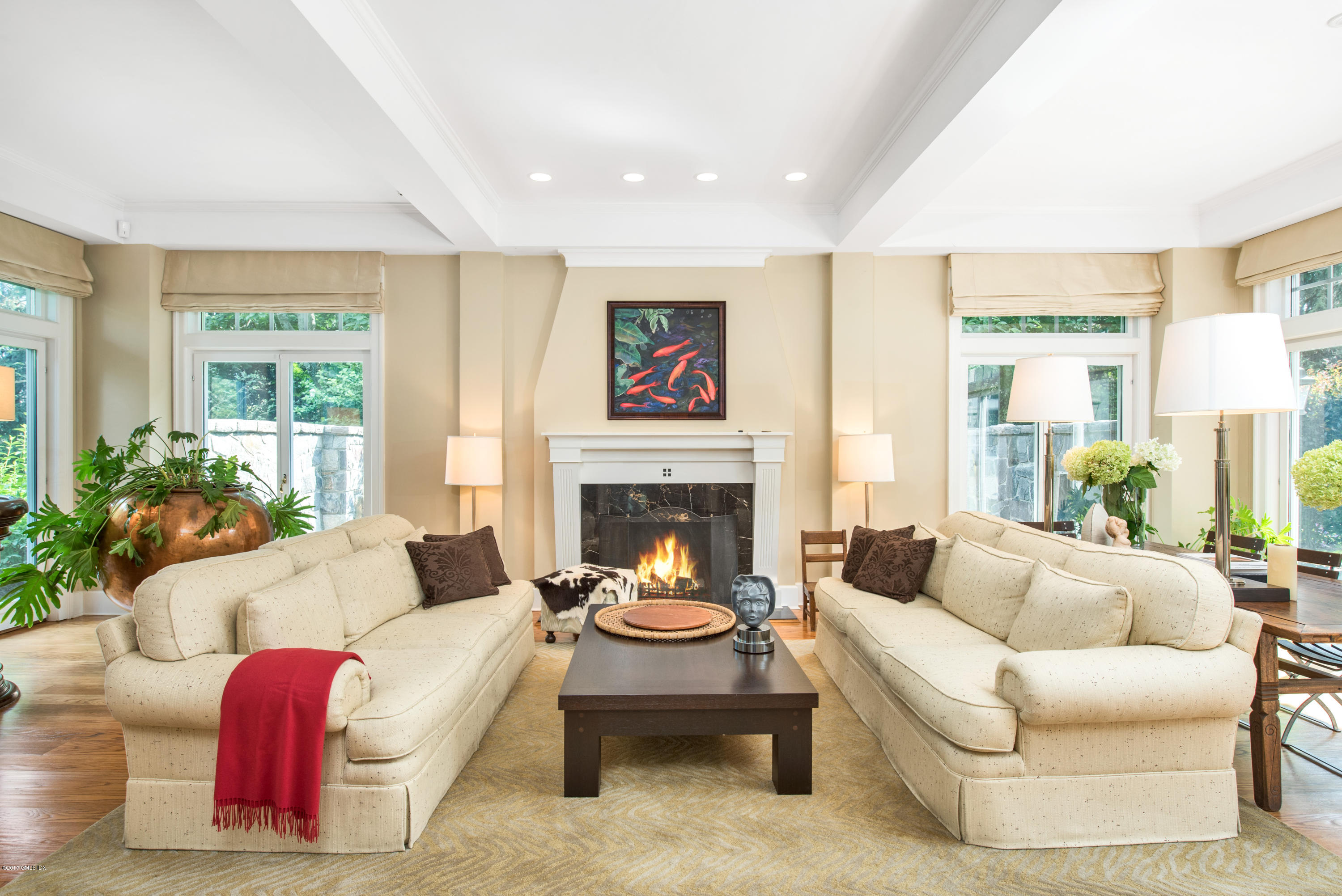 147 Byram Shore Road Greenwich, CT 06830 - Photo 5 of 19 a living room with furniture fireplace and a large window
