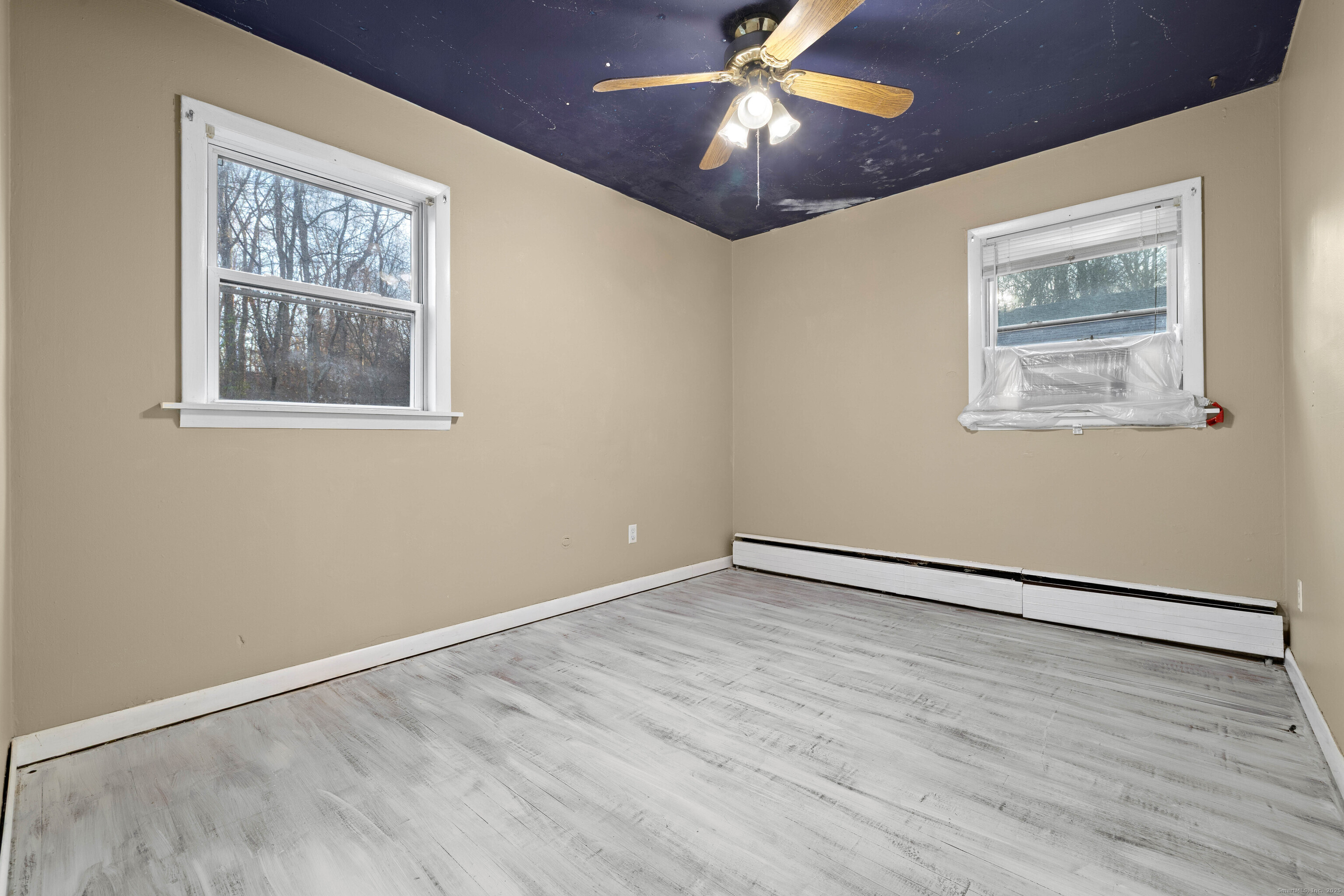 15 Egypt Lane Clinton, CT 06413 - Photo 24 of 40 a view of an empty room with wooden floor and a window