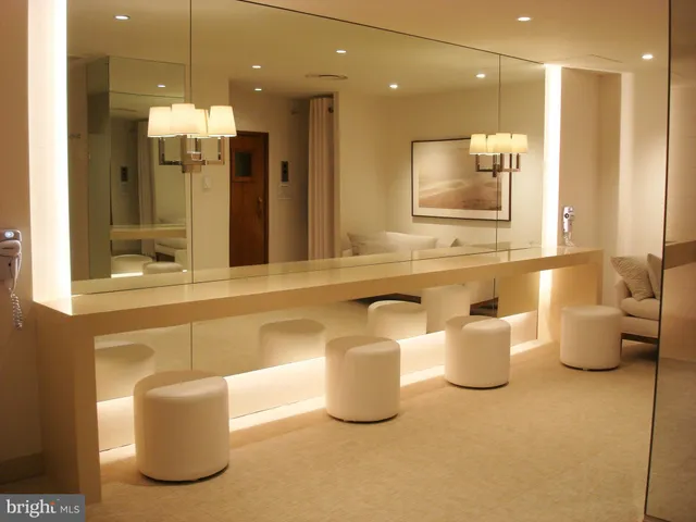 a large room with a table and chairs