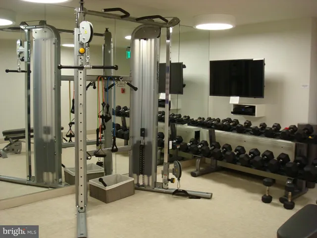 a view of a livingroom with furniture and a flat screen tv