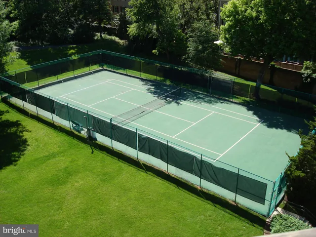 a view of an outdoor space and tennis court