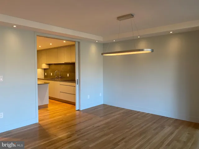 a view of kitchen and wooden floor