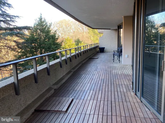 a view of balcony with couch and wooden floor