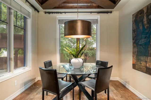 a dining room with furniture and window