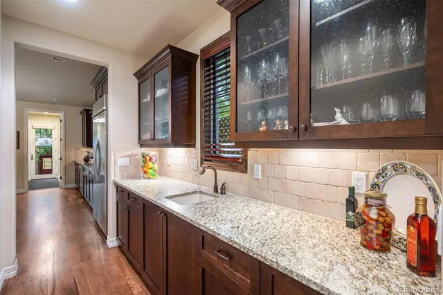 a kitchen with sink and cabinets