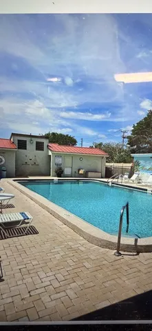 a view of a swimming pool with an ocean view