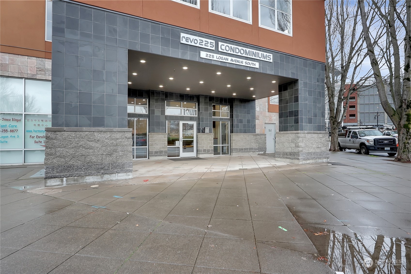 225 Logan Avenue South, Unit 307 Renton, WA 98057 - Photo 1 of 23 a view of a building with car parked