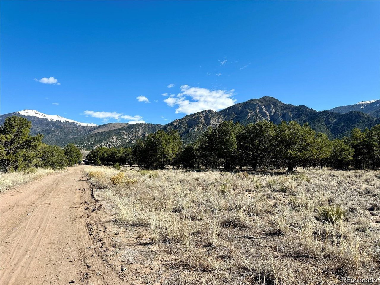 1 Block 61 Crestone, CO 81131 - Photo 5 of 11 a view of a backyard of a house with a mountain