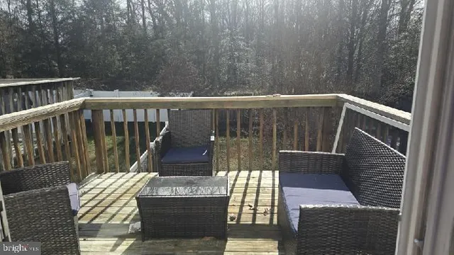 a view of balcony with wooden floor