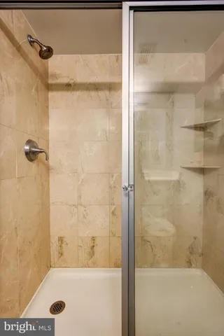 a bathroom with a bathtub and shower
