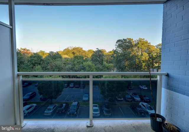 a view of a balcony with chairs