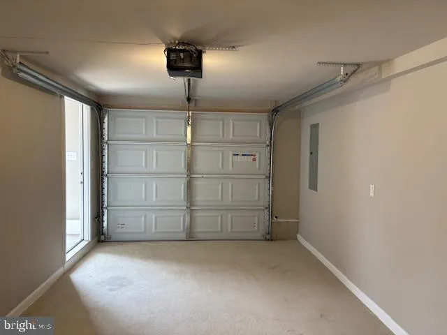 an empty room with wooden floor and a window