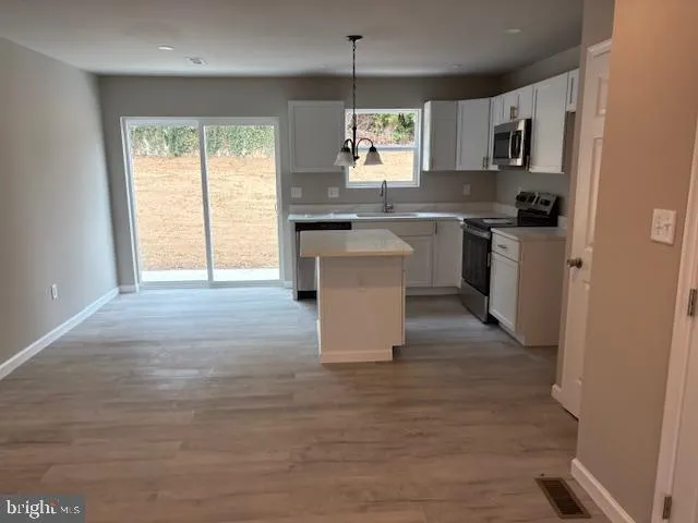 an empty room with closet and a bathroom