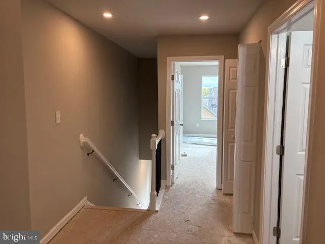 a view of a hallway with closet area