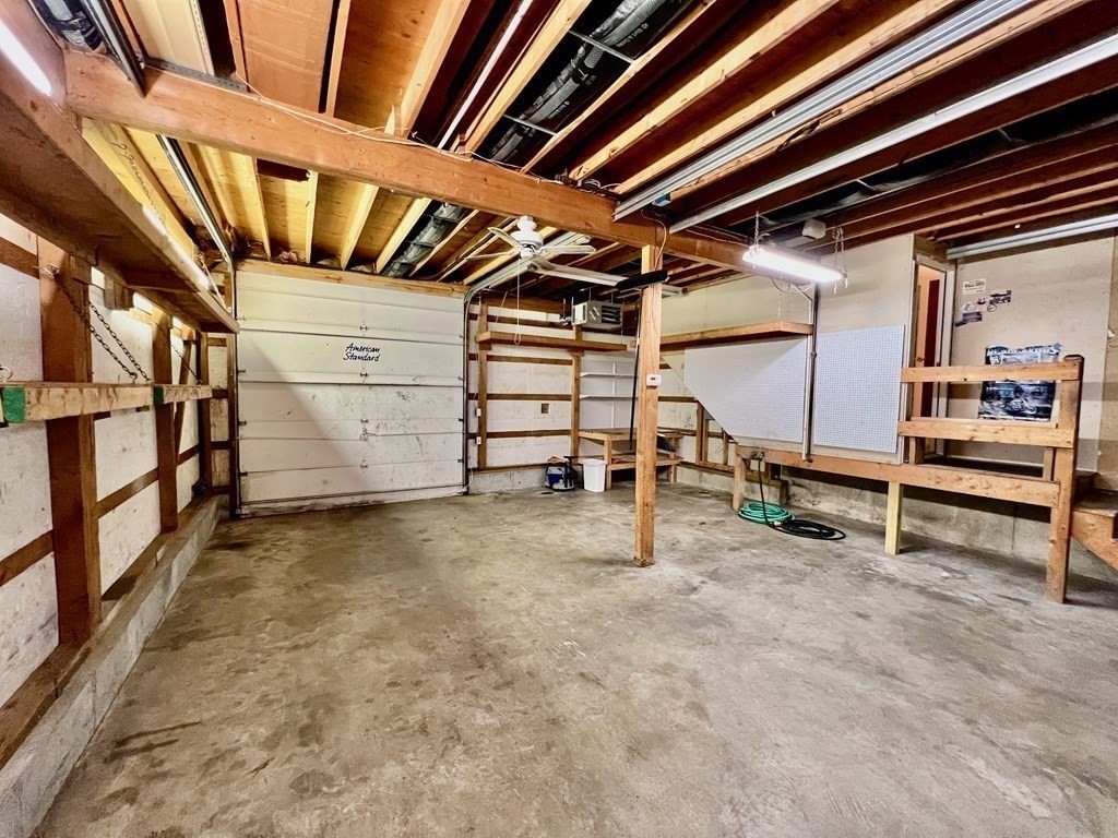 11 Lindsay Road Billerica, MA 01821 - Photo 12 of 17 a view of an empty room with racks on the wall