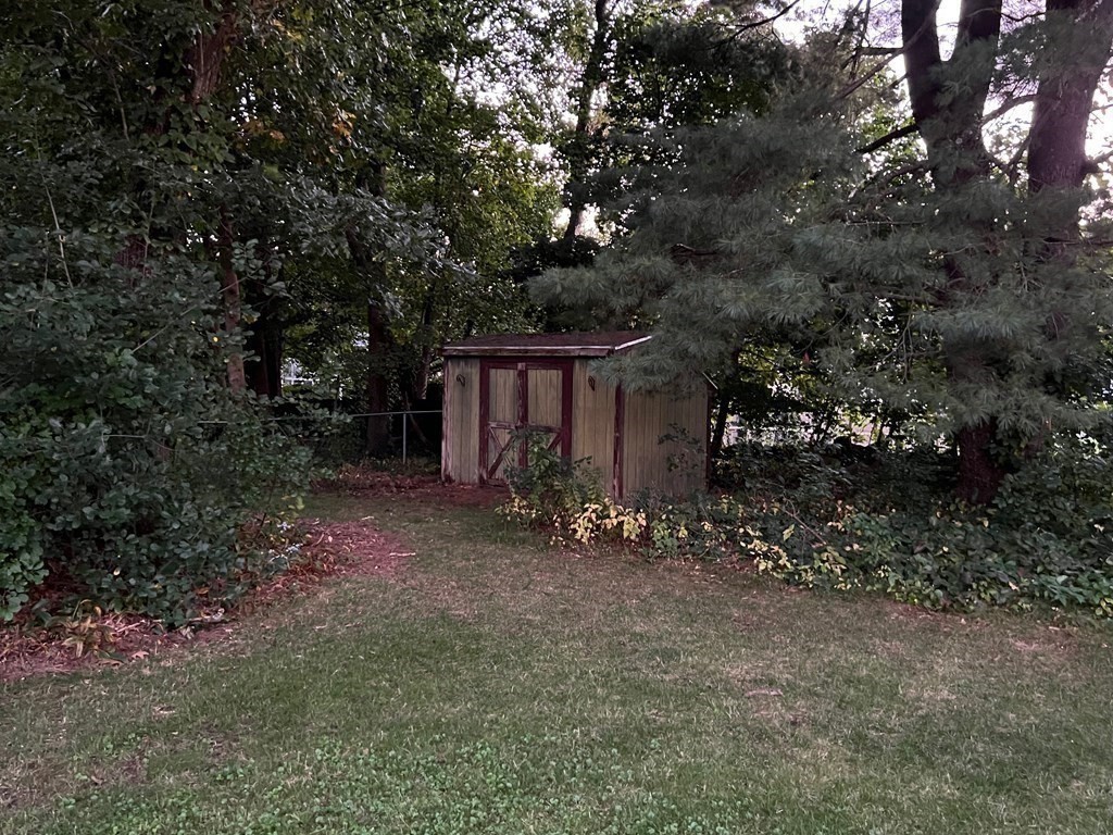 11 Lindsay Road Billerica, MA 01821 - Photo 16 of 17 a view of a house with a tree and wooden fence