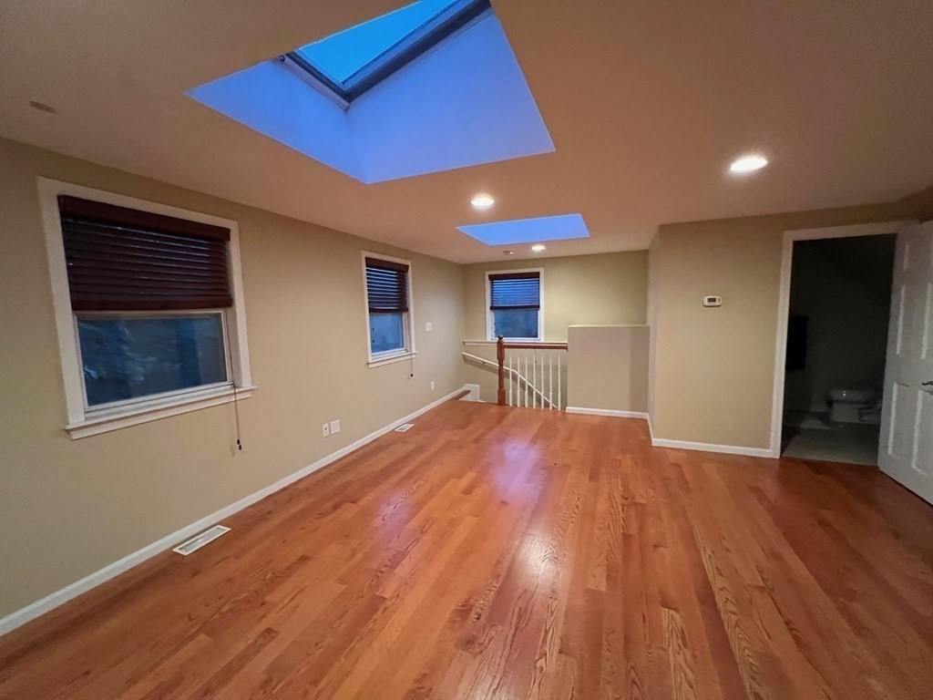 11 Lindsay Road Billerica, MA 01821 - Photo 8 of 17 a view of empty room with wooden floor