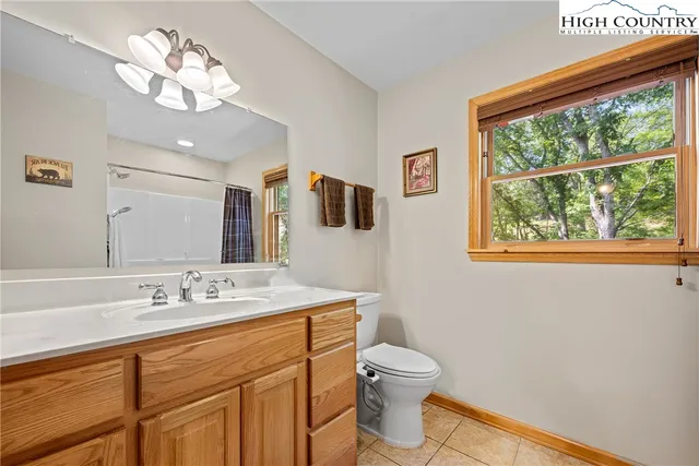 a bedroom with furniture window and wooden floor