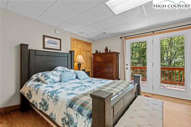 a bedroom with a bed dresser and a window