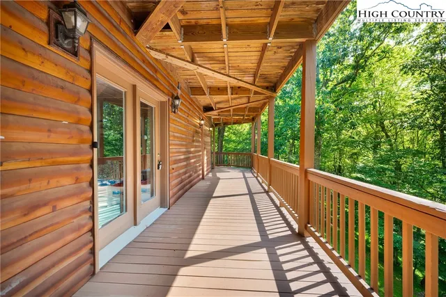 a view of a balcony with wooden floor
