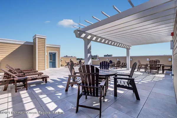 a view of a patio with table and chairs and potted plants