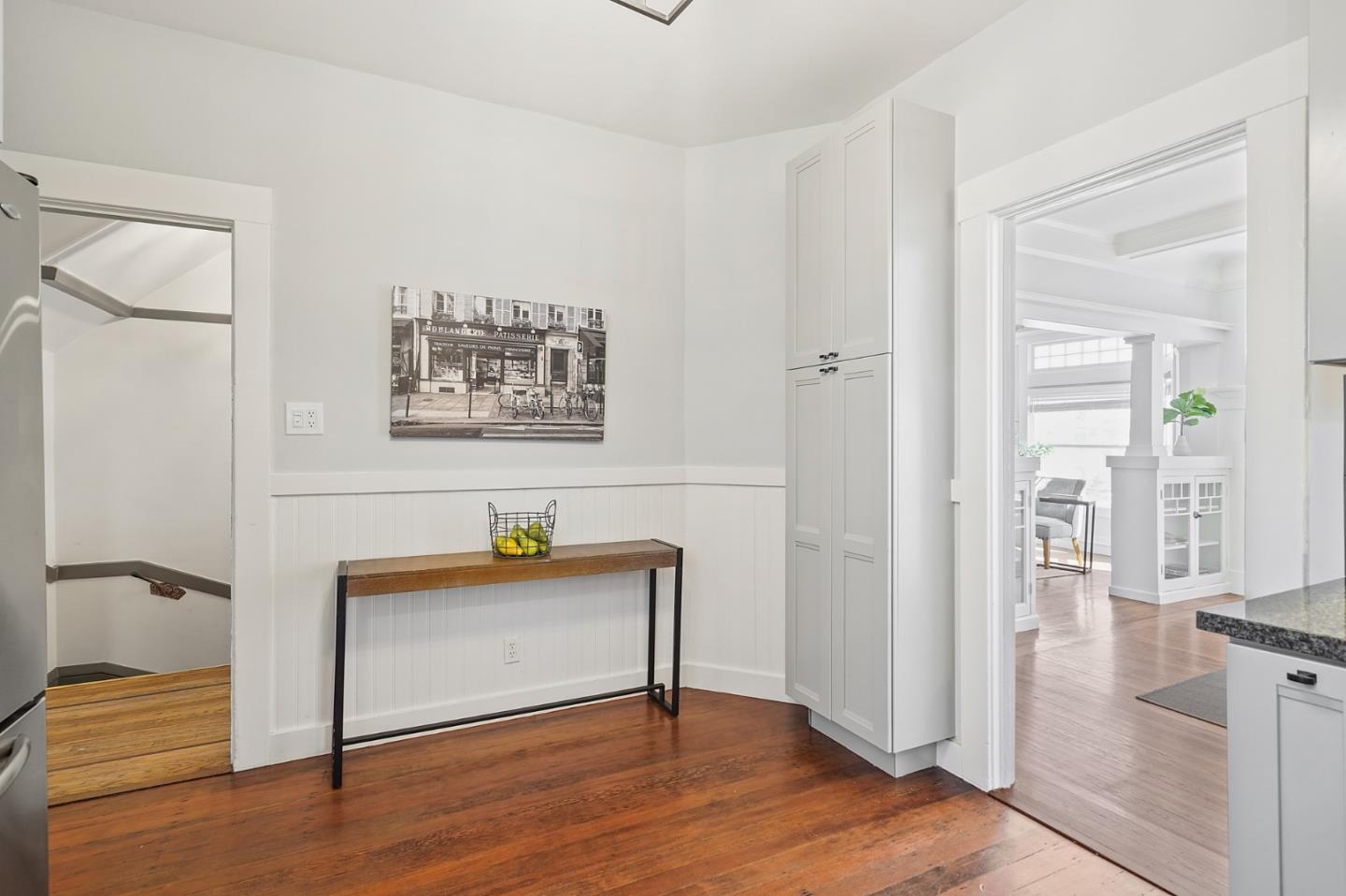 809 Masonic Avenue San Francisco, CA 94117 - Photo 12 of 30 a view of a hallway with wooden floor and a bathroom