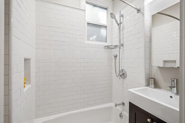 a bathroom with a sink shower and a bathtub