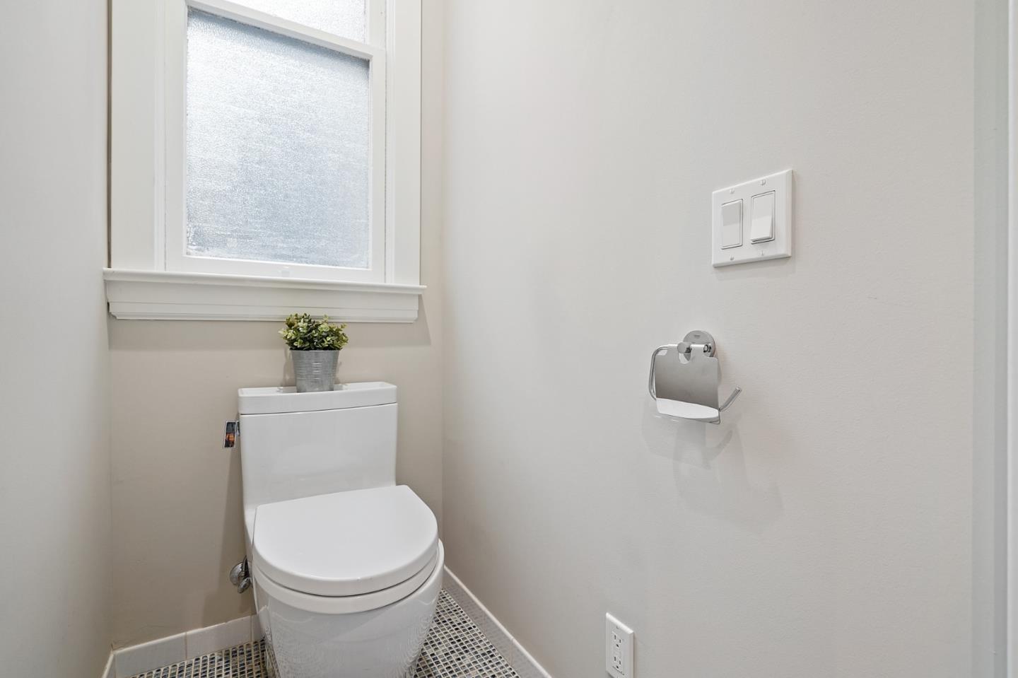 809 Masonic Avenue San Francisco, CA 94117 - Photo 18 of 30 a white toilet sitting next to a window
