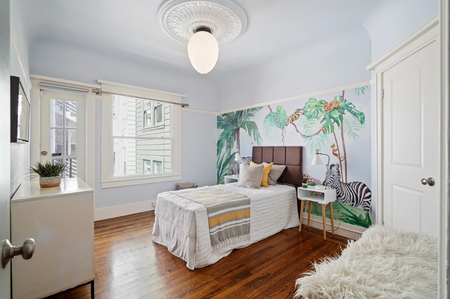 809 Masonic Avenue San Francisco, CA 94117 - Photo 19 of 30 a bedroom with a bed and a window