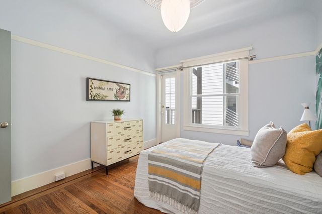 a bedroom with a bed and a dresser