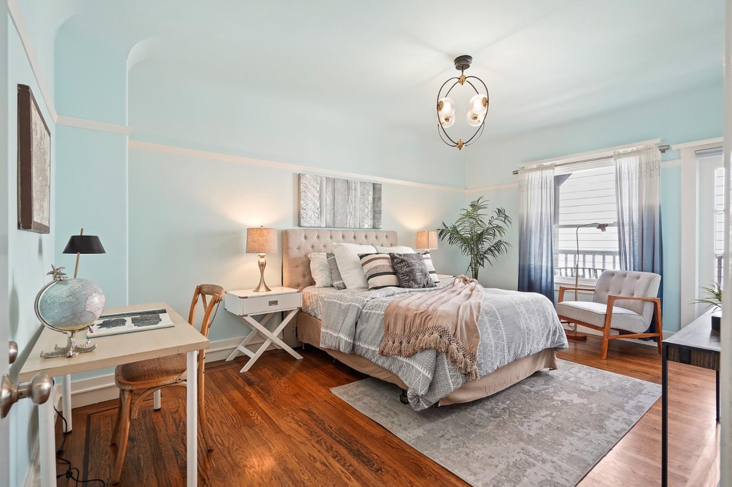 809 Masonic Avenue San Francisco, CA 94117 - Photo 22 of 30 a bedroom with a bed and window