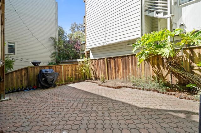 a view of a backyard of the house