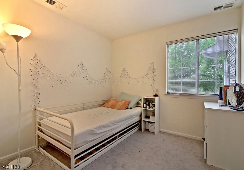 62 Bentley Court Bedminster, NJ 07921 - Photo 11 of 15 a bedroom with a bed and a table