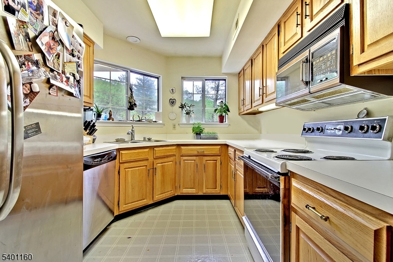 62 Bentley Court Bedminster, NJ 07921 - Photo 3 of 15 a kitchen with stainless steel appliances granite countertop a sink and a stove