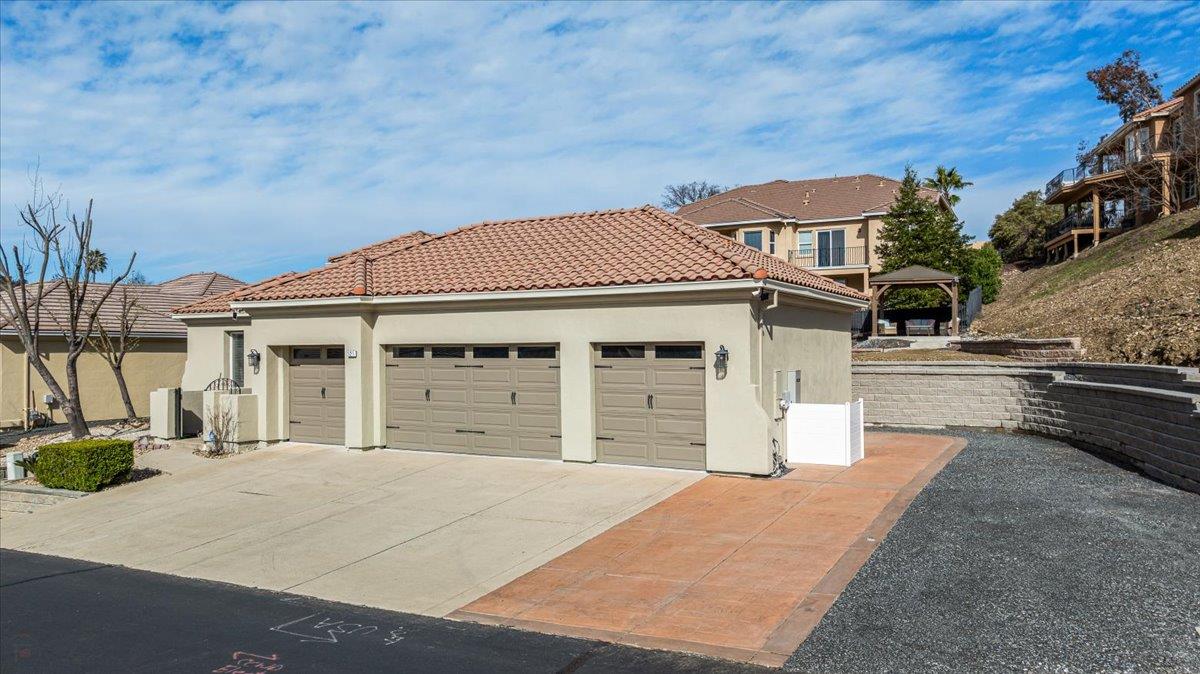 121 Athena Drive Copperopolis, CA 95228 - Photo 3 of 90 Oversized 4-car garage, 56'L x 18'w side parking plus 70+' street parking.