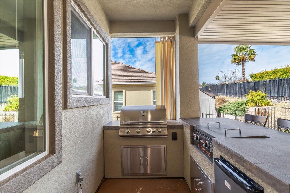 121 Athena Drive Copperopolis, CA 95228 - Photo 47 of 90 New outdoor kitchen with propane BBQ, Blackstone grill and refrigerator