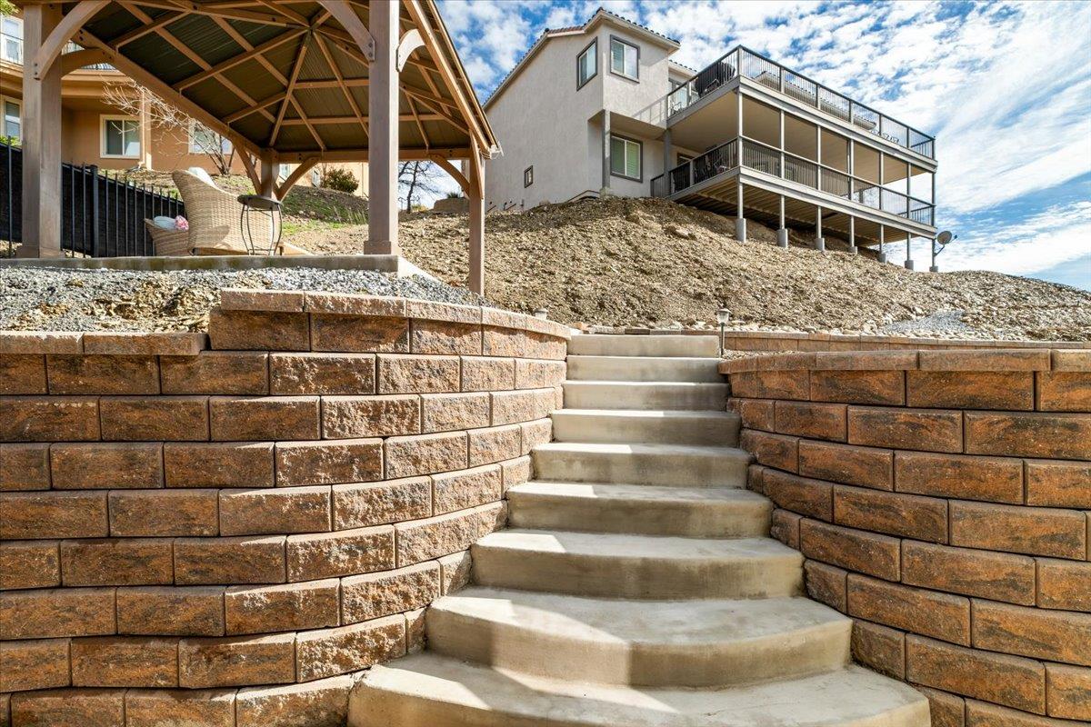 121 Athena Drive Copperopolis, CA 95228 - Photo 56 of 90 All new retaining walls, French drain system and elevated patio seating with pergola