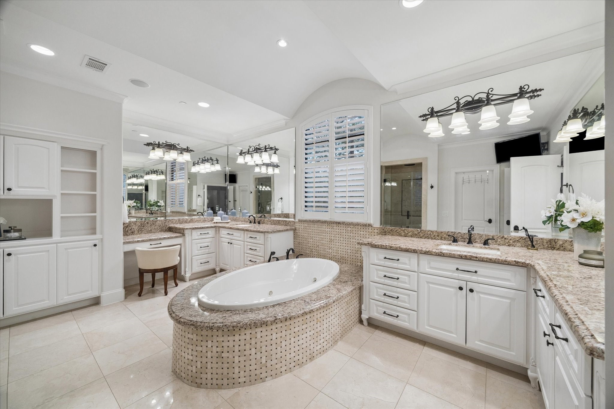 4511 Merrie Lane Bellaire, TX 77401 - Photo 24 of 46 a bathroom with a tub sink and mirror