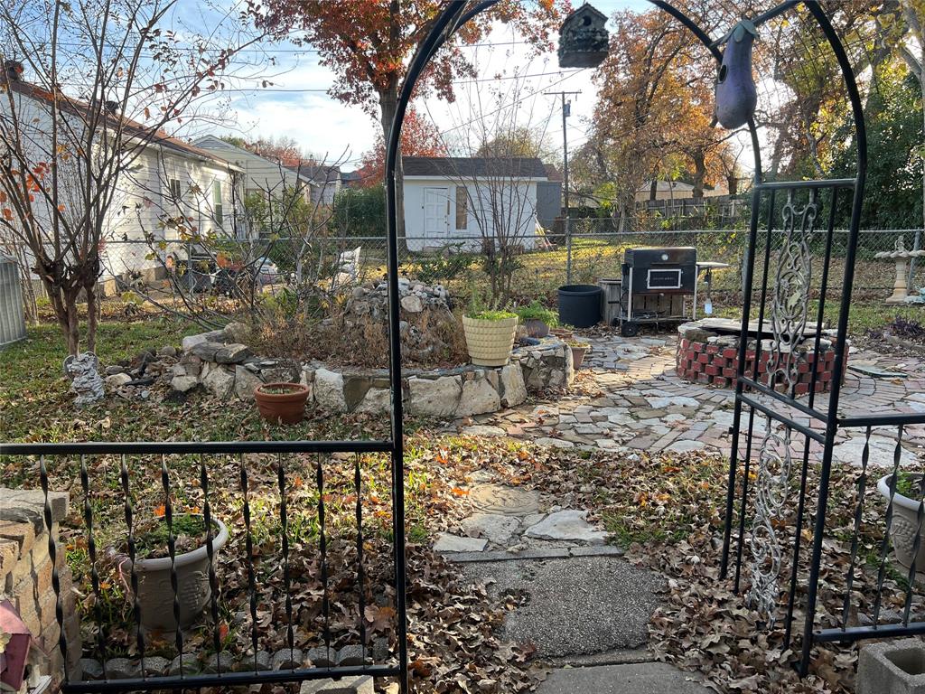 909 Rindie Street Irving, TX 75060 - Photo 13 of 18 a view of a chair and table in the patio