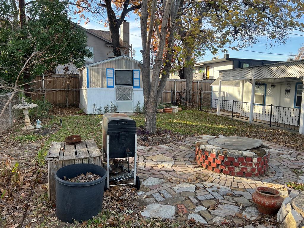 909 Rindie Street Irving, TX 75060 - Photo 14 of 18 a view of a patio with chair and tables back yard of the house