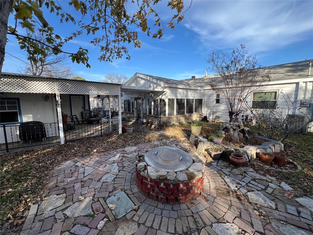 909 Rindie Street Irving, TX 75060 - Photo 15 of 18 a view of a chairs and tables in the patio