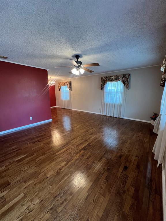 909 Rindie Street Irving, TX 75060 - Photo 2 of 18 wooden floor in an empty room with a window