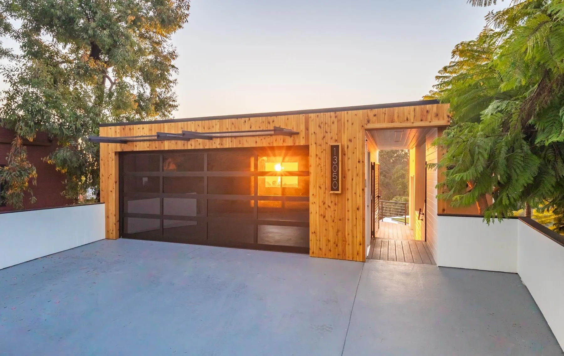 13050 Via Grimaldi Del Mar, CA 92014 - Photo 1 of 1 a view of a room with wooden walls and potted plants